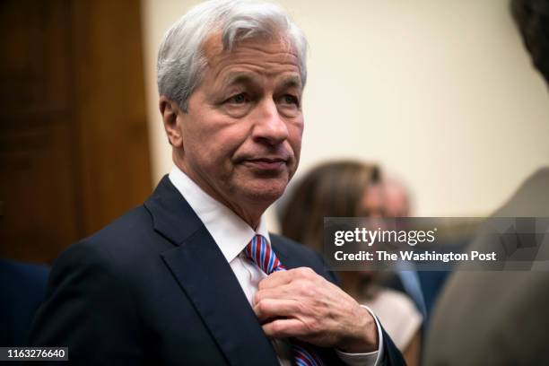 Jamie Dimon, Chair and CEO of JP Morgan Chase, takes his seat to testify before the House Financial Services Commitee in Washington Wednesday April...