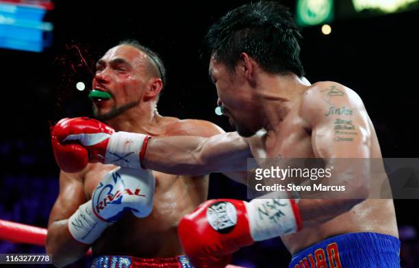 Keith Thurman takes a punch from Manny Pacquiao during their WBA... News  Photo - Getty Images