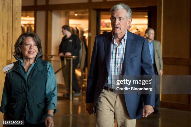 Jerome Powell, chairman of the U.S. Federal Reserve, right, and Elissa Leonard arrive for dinner during the Jackson Hole economic symposium,...