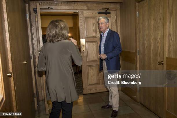 Jerome Powell, chairman of the U.S. Federal Reserve, right, arrives for dinner during the Jackson Hole economic symposium, sponsored by the Federal...