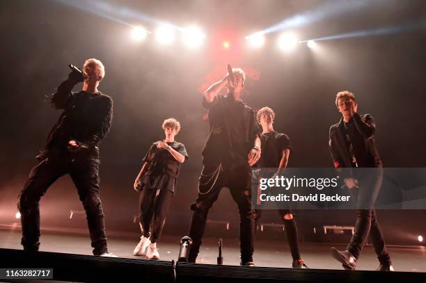 Singers Corbyn Besson, Jack Avery, Daniel Seavey, Zach Herron and Jonah Marais of Why Don't We perform at Park Theater at Park MGM on a stop of the...