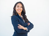 Smiling confident businesswoman posing with arms folded