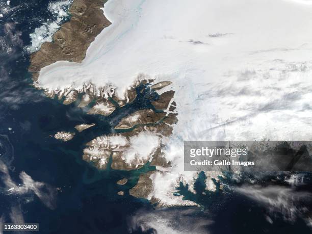 Satellite view of Northwestern Greenland in the Arctic Circle on August 12, 2019 in Pituffik, Greenland. On the shores of Baffin Bay is the US Thule...