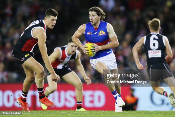 Marcus Bontempelli of the Bulldogs runs with the ball during the round 18 AFL match between the St Kilda Saints and the Western Bulldogs at Marvel...