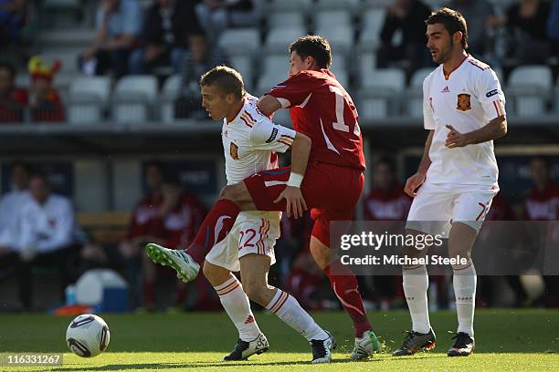 Iker Muniain of Spain holds off Marek Suchy as Adrian looks on during the UEFA European Under-21 Championship Group B match between Czech Republic...