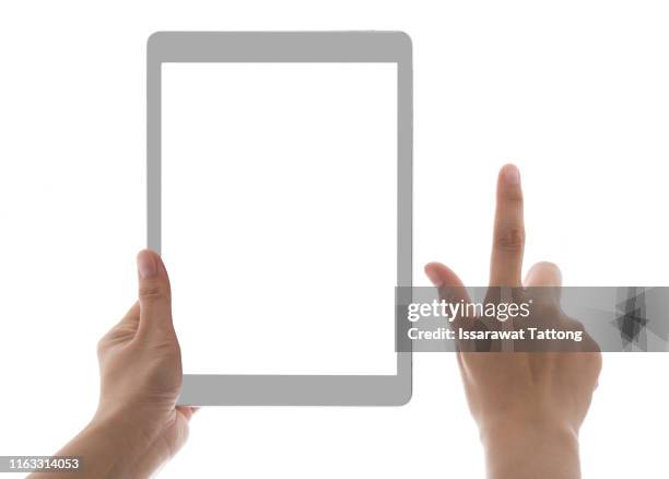 hands holding and touching on tablet pc isolated on white background - ipad hand foto e immagini stock