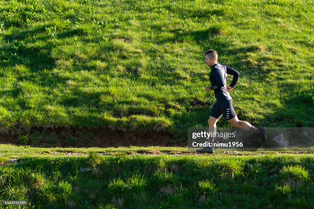 Out Train Running Young Male Athlete Trains Running In The Mountains At Sunrise High-Res ...