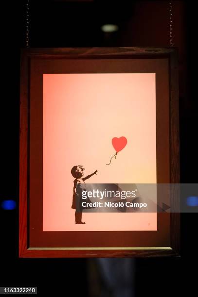 The artwork 'Girl with Balloon' by Banksy is pictured at the 'Street Art in Blu' exhibition. The street art exhibition will remain open until...