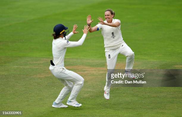 Laura Marsh of England celebrates taking the wicket of Alyssa Healy of Australia during day four of the Kia Women's Test Match between England Women...