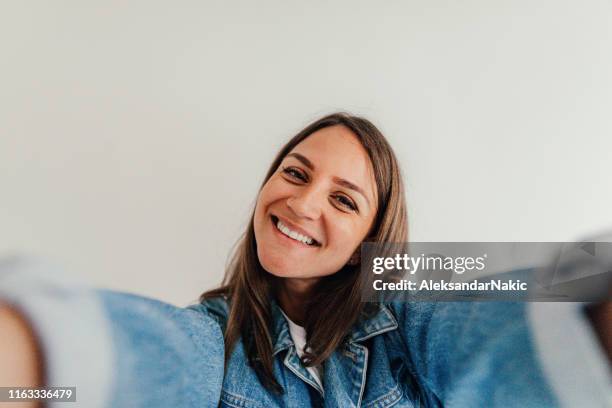 selfie - taking selfie white background stockfoto's en -beelden