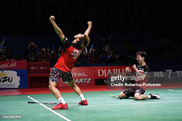 Marcus Fernaldi Gideon and Kevin Sanjaya Sukamuljo of Indonesia celebrate victory after beating Mohammad Ahsan and Hendra Setiawan of Indonesia...