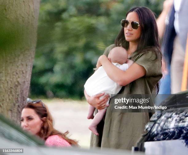 Meghan, Duchess of Sussex, Archie Harrison Mountbatten-Windsor and Catherine, Duchess of Cambridge attend the King Power Royal Charity Polo Match, in...