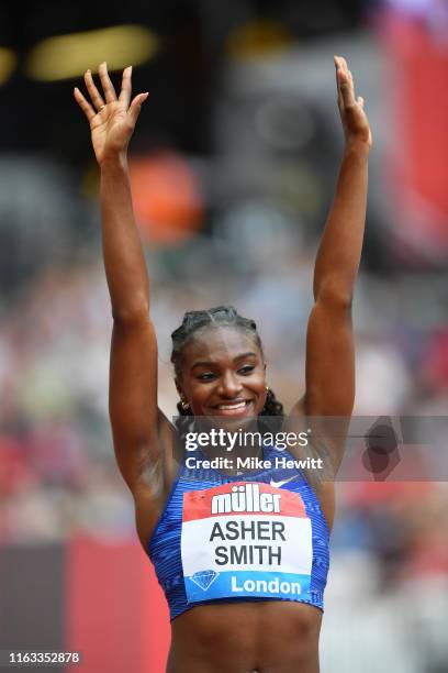 Dina Asher-Smith of Great Britain waves to the crowd ahead of competing in the Women's 100m during Day Two of the Muller Anniversary Games IAAF...