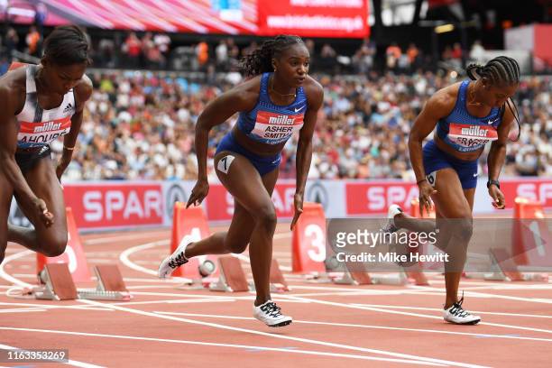 Shelly-Ann Fraser-Pryce of Jamaica and Dina Asher-Smith of Great Britain compete in the Women's 100m during Day Two of the Muller Anniversary Games...