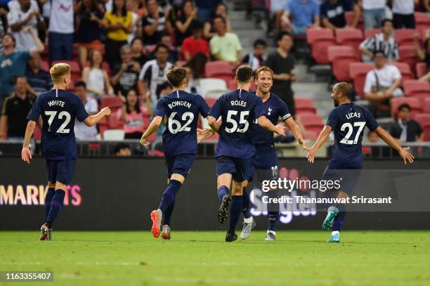 Harry Kane of Tottenham Hotspur celebrates scoring his side's third goal with his team mates during the International Champions Cup match between...