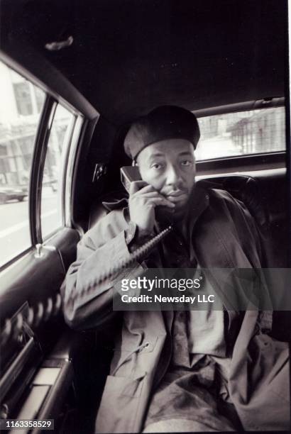 Rap music mogul Russell Simmons talks on the telephone in the back seat of a car in Manhattan on his way uptown to a meeting with Quincy Jones on...