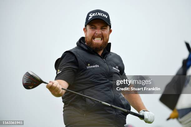 Shane Lowry of Ireland reacts to his shot from the 12th tee during the final round of the 148th Open Championship held on the Dunluce Links at Royal...