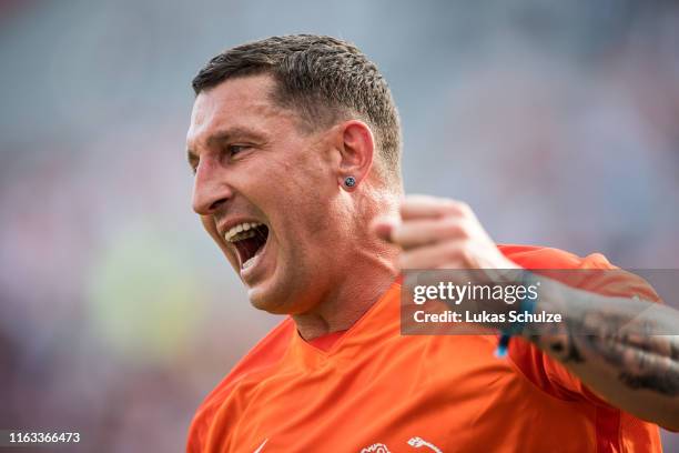 Stefan Kretzschmar celebrates after scoring his team's third goal during the charity match Champions For Charity at BayArena on July 21, 2019 in...