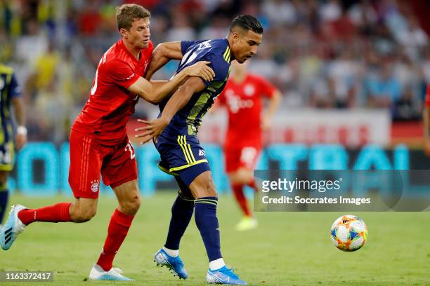 Thomas Muller of Bayern Munchen, Nabil Dirar of Fenerbahce during the Audi Cup match between Bayern Munchen v Fenerbahce at the Allianz Arena on July...