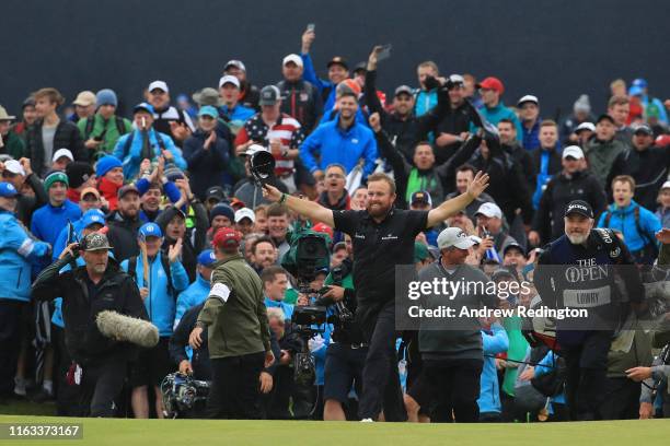 Open Champion Shane Lowry of Ireland celebrates on the 18th green during the final round of the 148th Open Championship held on the Dunluce Links at...