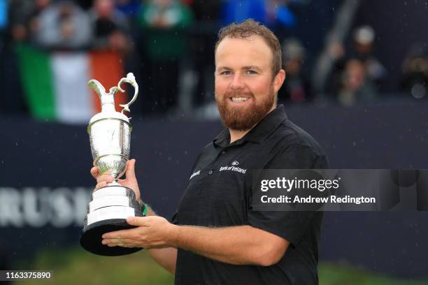 Open Champion Shane Lowry of Ireland celebrates with the Claret Jug on the 18th green during the final round of the 148th Open Championship held on...