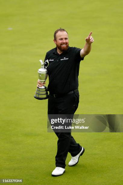 Open Champion Shane Lowry of Ireland celebrates with the Claret Jug on the 18th green during the final round of the 148th Open Championship held on...