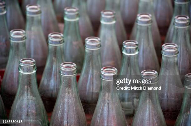 glass drinking bottles in carnival toss - ring toss stock pictures, royalty-free photos & images