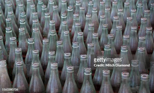 glass drinking bottles in carnival toss - ring toss stock pictures, royalty-free photos & images