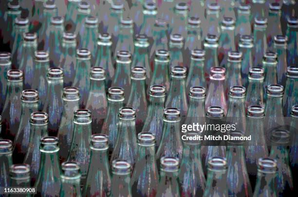 glass drinking bottles in carnival toss - ring toss imagens e fotografias de stock