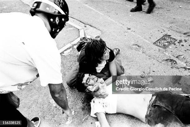 Protester injured after clashes with police during a protest against the 27th G8 Summit In Genoa, on July 21, 2001 in Genoa, Italy. Hundreds of...