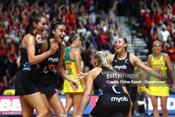 Ameliaranne Ekenasio, Maria Folau and Laura Landman of New Zealand celebrate after winning The Final of The Vitality Netball World Cup between New...