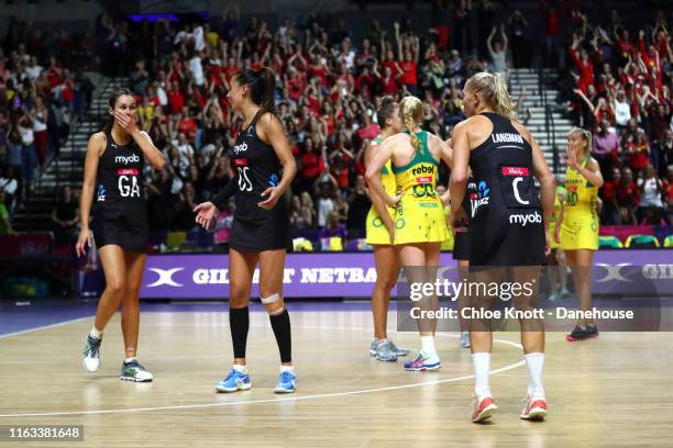 Ameliaranne Ekenasio, Maria Folau and Laura Landman of New Zealand celebrate after winning The Final of The Vitality Netball World Cup between New...