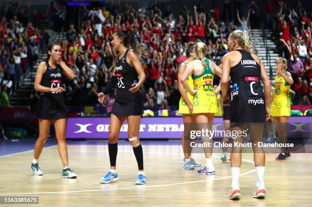 Ameliaranne Ekenasio, Maria Folau and Laura Landman of New Zealand celebrate after winning The Final of The Vitality Netball World Cup between New...