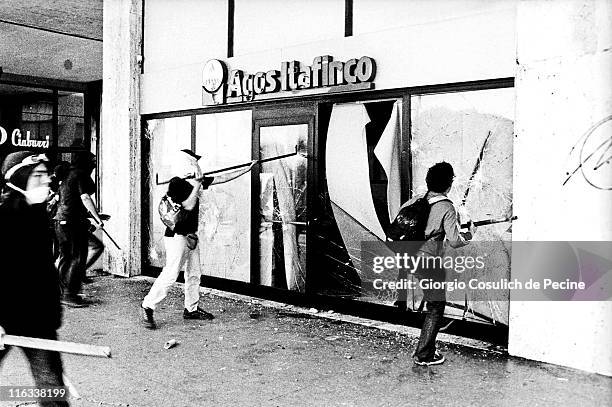 Anti-globalisation activists attack a bank during a protest against the 27th G8 Summit In Genoa, on July 21, 2001 in Genoa, Italy. Hundreds of...