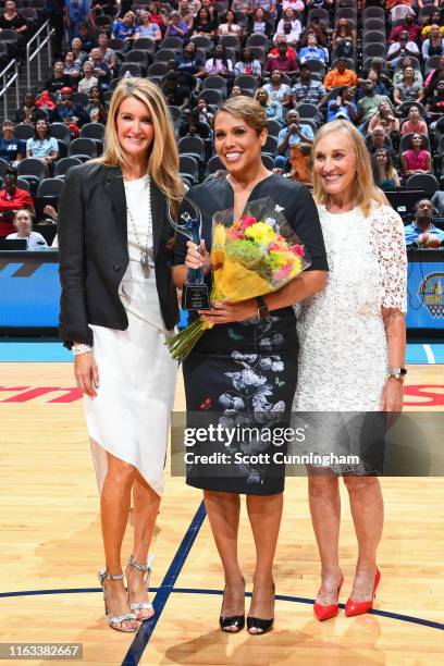 Atlanta Dream co-owners Mary Brock and Kelly Loeffler recognize WSB Anchor Jovita Moore on Women of Inspiration night during the game between the...