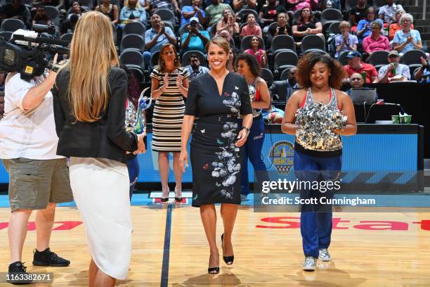 Atlanta Dream co-owners Mary Brock and Kelly Loeffler recognize WSB Anchor Jovita Moore on Women of Inspiration night during the game between the...