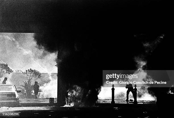 Fire after clashes between police and activists from the anti-globalization movement during a protest against the 27th G8 Summit In Genoa, on July...