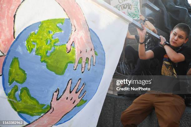 People attend 'SOS Amazonia!' protest organized by the Youth Climate Strike at the Main Square in Krakow, Poland on 23 August, 2019. Activists demand...