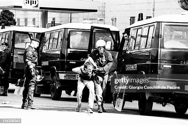 Police arrests an activist during an anti-globalization protest against the 27th G8 Summit In Genoa, on July 21, 2001 in Genoa, Italy. Hundreds of...