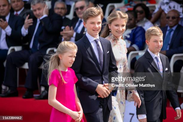 Princess Eléonore of Belgium, Prince Gabriël, Princess Elisabeth and Prince Emmanuel prior attend the military parade during the National Day of...