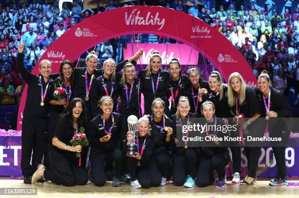 The New Zealand team lift The World Cup Trophy on Day 10 of The Vitality Netball World Cup at M&S Bank Arena on July 21, 2019 in Liverpool, England.