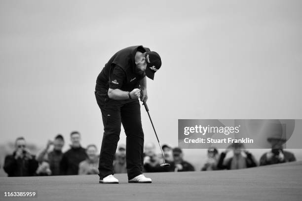 Shane Lowry of Ireland reacts to his birdie on the 15th green during the final round of the 148th Open Championship held on the Dunluce Links at...