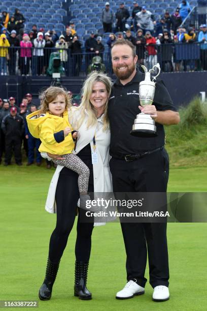 Shane Lowry of Ireland poses with wife Wendy and daughter Iris and the Claret Jug following the final round of the 148th Open Championship held on...