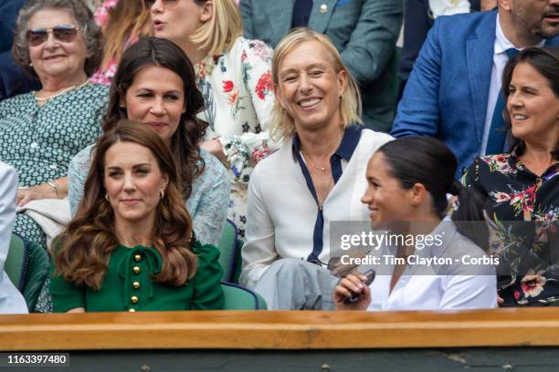 July 13: Catherine, Duchess of Cambridge and Meghan, Duchess of Sussex in the Royal Box on Centre Court talking with Martina Navratilova and her...