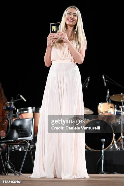 Martina Stella is seen on stage during the Nations Award 2019 ceremony at Teatro Antico on July 21, 2019 in Taormina, Italy.