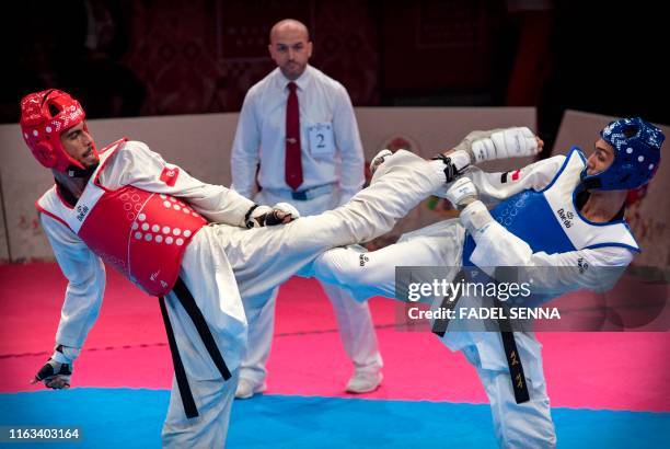 Egypte's Seif Eissa and Tunisia's Firas Katoussi compete during the Taekwondo men's 68 kg - 74 kg finals at the 12th edition of the "African Games"...