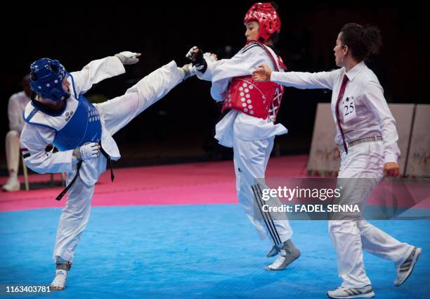 Egypte's Rewan Rafaei Morocco's Safia Salih compete during the Taekwondo women's 57 kg - 62 kg finals at the 12th edition of the "African Games" on...