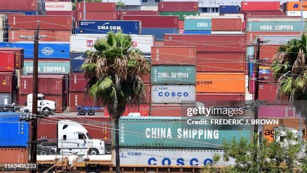 Container trucks arrive at the Port of Long Beach on August 23, 2019 in Long Beach, California. - President Donald Trump hit back at China on August...