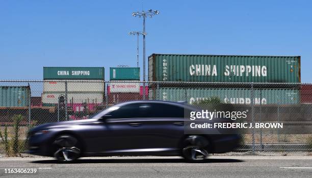 China Shipping containers are pictured at Port of Long Beach on August 23, 2019 in Long Beach, California. - President Donald Trump hit back at China...