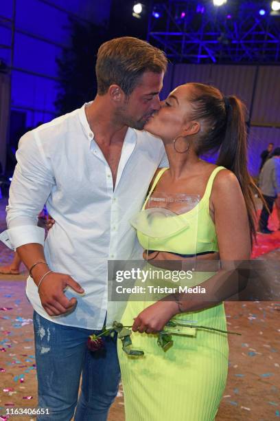 Winner Janine Pink and her boyfriend Tobias Tobi Wegener attend the "Promi Big Brother" final at MMC Studios on August 23, 2019 in Cologne, Germany.